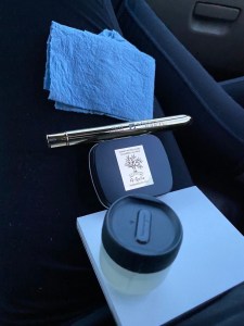 Shop cloth, pro-arte prolene travel brush, a Gallo landscape set of 6 half pans in a tiny tin, 4x6 block of watercolor paper, and the 1oz nalgene water container from humangear