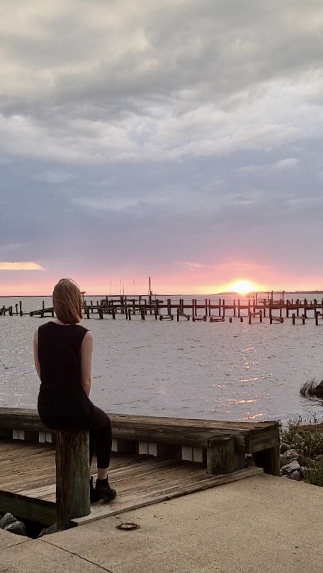 Me watching the sunset sitting on the dock at Avalon Beach Boating Access OBX