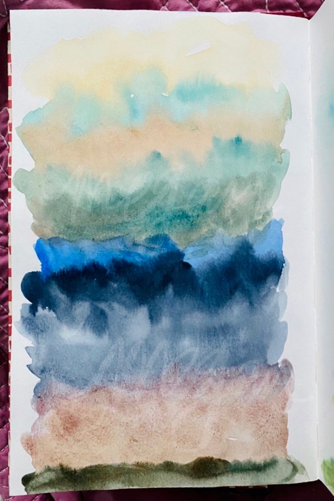 Watercolor painting. Watercolor painting. Wide sections of color from one color listed to the other; the paper is vertical. You can see a lot of movement between colors because of the water.  Yellow raw ochre, cinerious, burnt sienna, ultramarine turquoise, ultramarine, indigo, potters pink, goethite, mars black