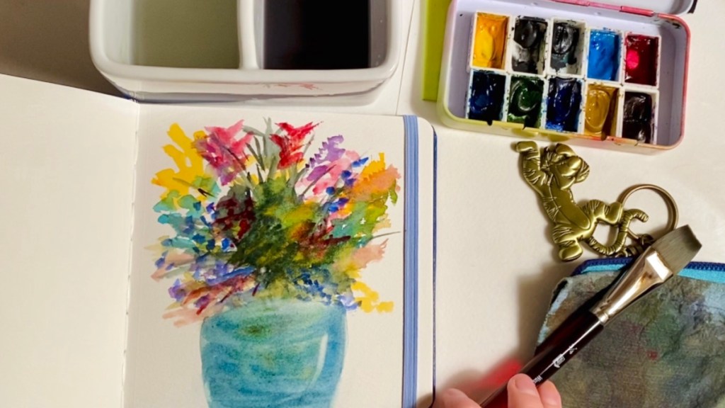 The flowers I painted in the background of the youtube video I made that goes with this post, you can see my hand with a 3/4 flat brush and tigger keychain to the right. 