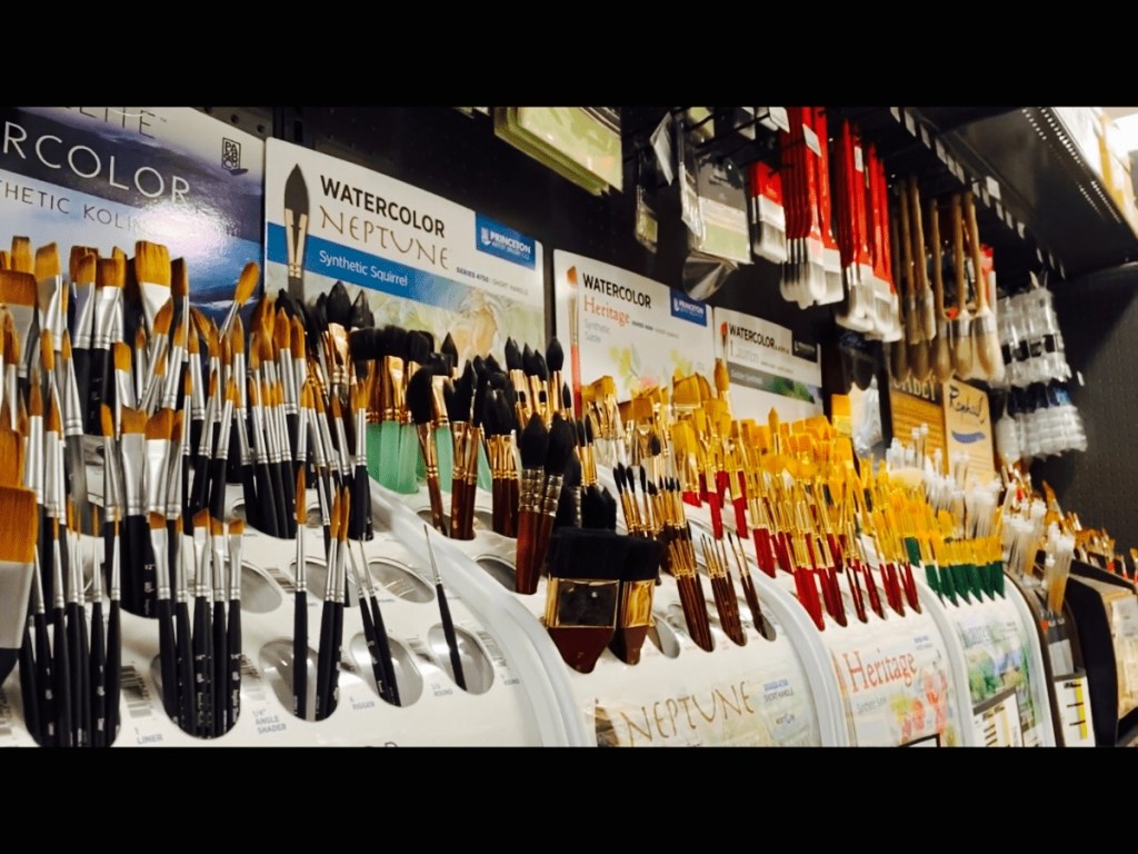 Many watercolor brushes on display in Blick Art Materials in DC