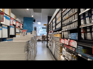 Large stacks of canvases in the acrylics aisle of Blick Art Materials in DC 