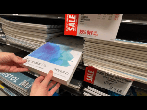 Mom’s hand and mine holding the Fabriano fat pad in Blick Art Materials in DC