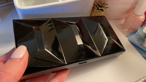 My hand holding the shiny black Goldilocks size (medium) Whiskey Painters palette 