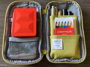 Vermillion bijou in my green travel lihit lab bag 